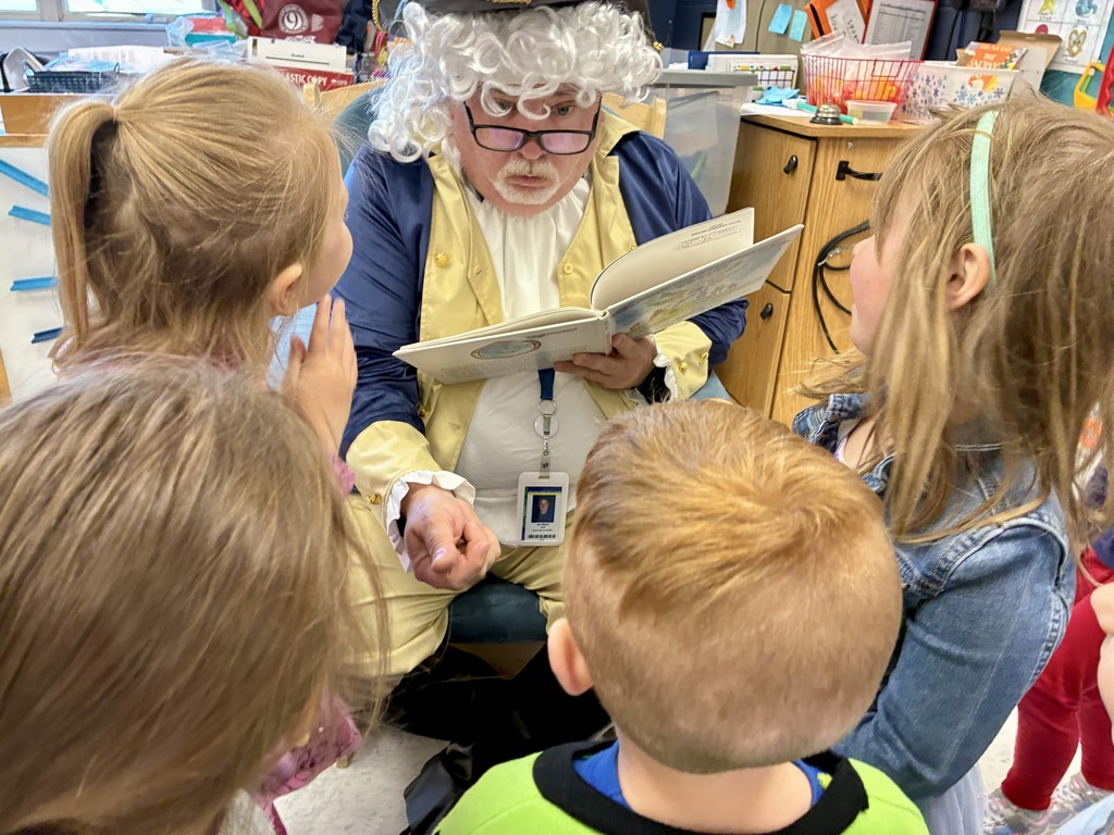 🇺🇸  Our preschoolers had a special visit from none other than George Washington today! He stopped by to read a story… but things got a little interesting when his teeth fell out mid-visit! 😆🦷  The students were full of giggles while learning a little history along the way—definitely a moment they won’t forget! ❤️📚  We love bringing learning to life in fun and memorable ways. Way to go, Rams! 🐏👏