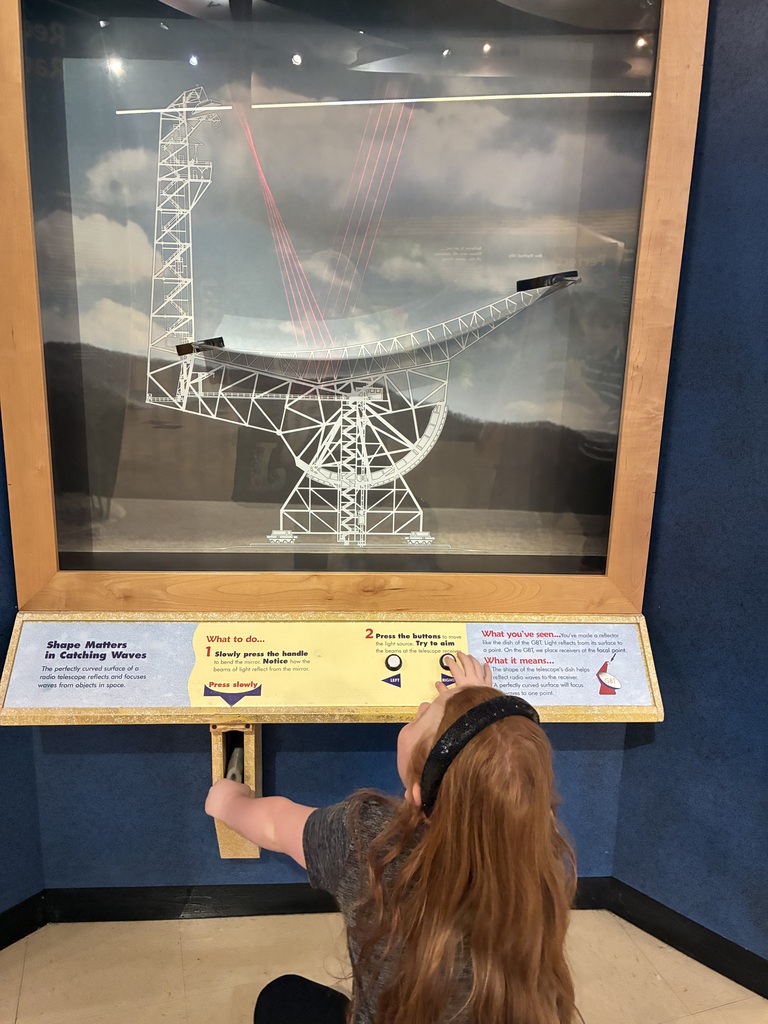 ✨🔭 Our Highland Elementary gifted students recently enjoyed an exciting educational trip to the Green Bank Observatory! Students toured the grounds and discovered a variety of incredible radio telescopes, including the Green Bank Telescope (GBT)—the largest fully steerable radio telescope in the United States! 🤯 It stands over 300 feet tall with an aperture the size of a football field! 🏈📡 Students also explored interactive exhibits and put their engineering skills to the test in a fun challenge—building telescope towers out of paper strong enough to hold canned food! 🛠️📚 To top off a fantastic day of learning, everyone enjoyed a pizza party at the Starlight Café! 🍕🌟 What an amazing hands-on experience exploring science, engineering, and the wonders of space! 🚀💙💛