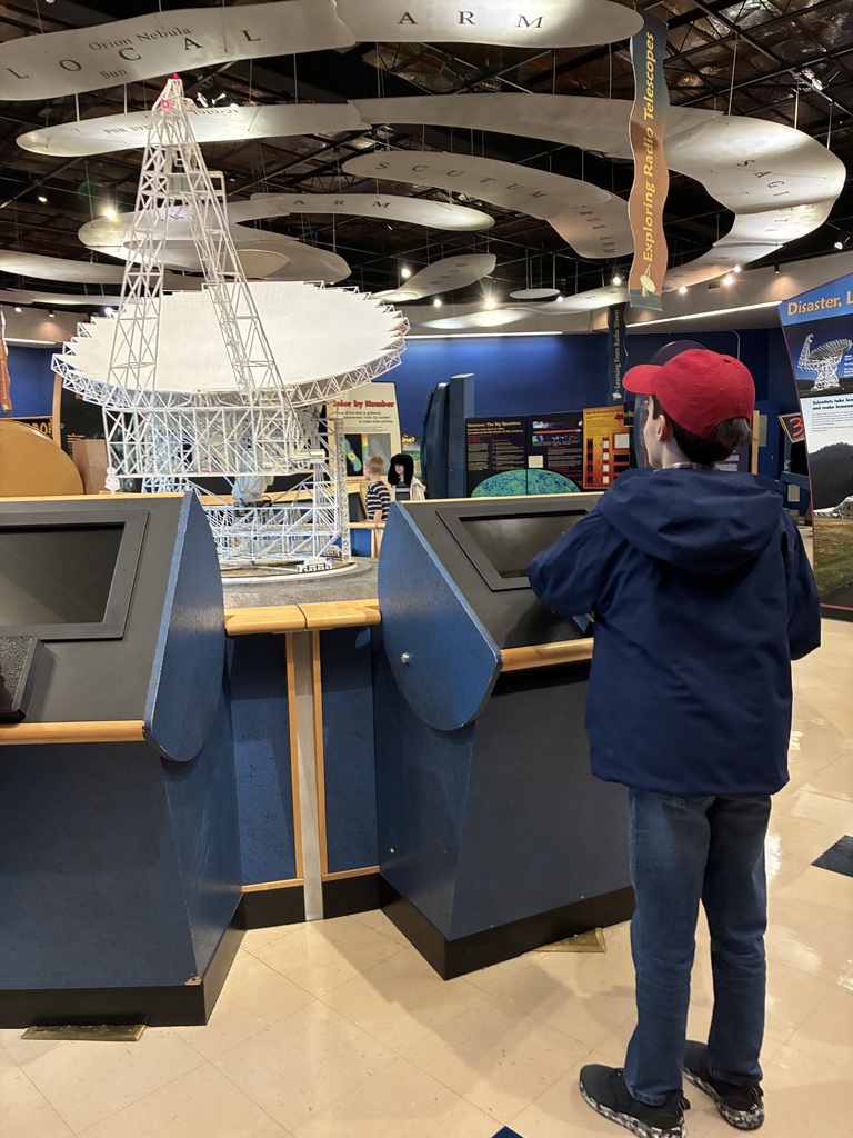 ✨🔭 Our Highland Elementary gifted students recently enjoyed an exciting educational trip to the Green Bank Observatory! Students toured the grounds and discovered a variety of incredible radio telescopes, including the Green Bank Telescope (GBT)—the largest fully steerable radio telescope in the United States! 🤯 It stands over 300 feet tall with an aperture the size of a football field! 🏈📡 Students also explored interactive exhibits and put their engineering skills to the test in a fun challenge—building telescope towers out of paper strong enough to hold canned food! 🛠️📚 To top off a fantastic day of learning, everyone enjoyed a pizza party at the Starlight Café! 🍕🌟 What an amazing hands-on experience exploring science, engineering, and the wonders of space! 🚀💙💛