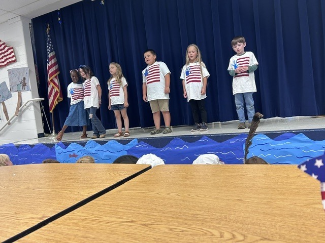 Our kindergarten students truly had a night to shine at HES! Families gathered for a picnic dinner before enjoying a wonderful performance by the children. In celebration of our nation's 250th anniversary, the students proudly recited selections from The Flag We Love by Judi Harris and sang several beloved American songs. The program also featured students portraying historical figures from our SOL studies, bringing history to life for the audience. The evening included a retelling of the classic tale The Three Billy Goats Gruff, followed by a fun and humorous twist with The Three Silly Girls Grubb by John and Ann Hassett. The children did an amazing job showcasing their learning, confidence, and creativity. Thank you to all the families who attended and supported this special event. It was a memorable evening filled with smiles, laughter, and pride in all our young learners! 🌟🇺🇸📚🎶