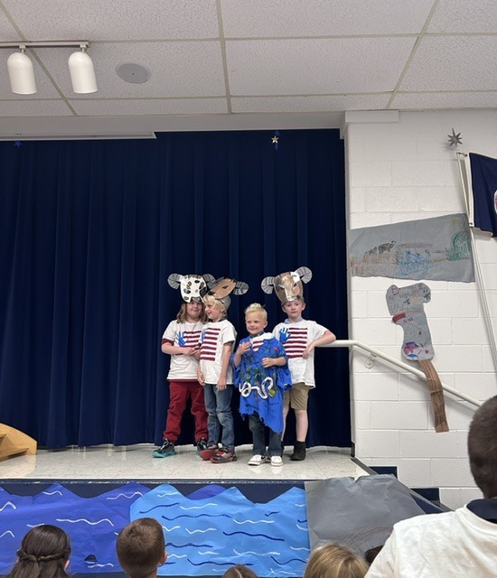 Our kindergarten students truly had a night to shine at HES! Families gathered for a picnic dinner before enjoying a wonderful performance by the children. In celebration of our nation's 250th anniversary, the students proudly recited selections from The Flag We Love by Judi Harris and sang several beloved American songs. The program also featured students portraying historical figures from our SOL studies, bringing history to life for the audience. The evening included a retelling of the classic tale The Three Billy Goats Gruff, followed by a fun and humorous twist with The Three Silly Girls Grubb by John and Ann Hassett. The children did an amazing job showcasing their learning, confidence, and creativity. Thank you to all the families who attended and supported this special event. It was a memorable evening filled with smiles, laughter, and pride in all our young learners! 🌟🇺🇸📚🎶