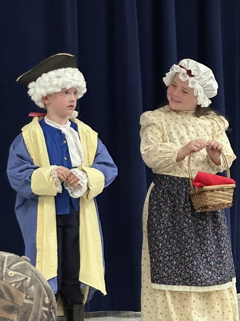 Our kindergarten students truly had a night to shine at HES! Families gathered for a picnic dinner before enjoying a wonderful performance by the children. In celebration of our nation's 250th anniversary, the students proudly recited selections from The Flag We Love by Judi Harris and sang several beloved American songs. The program also featured students portraying historical figures from our SOL studies, bringing history to life for the audience. The evening included a retelling of the classic tale The Three Billy Goats Gruff, followed by a fun and humorous twist with The Three Silly Girls Grubb by John and Ann Hassett. The children did an amazing job showcasing their learning, confidence, and creativity. Thank you to all the families who attended and supported this special event. It was a memorable evening filled with smiles, laughter, and pride in all our young learners! 🌟🇺🇸📚🎶