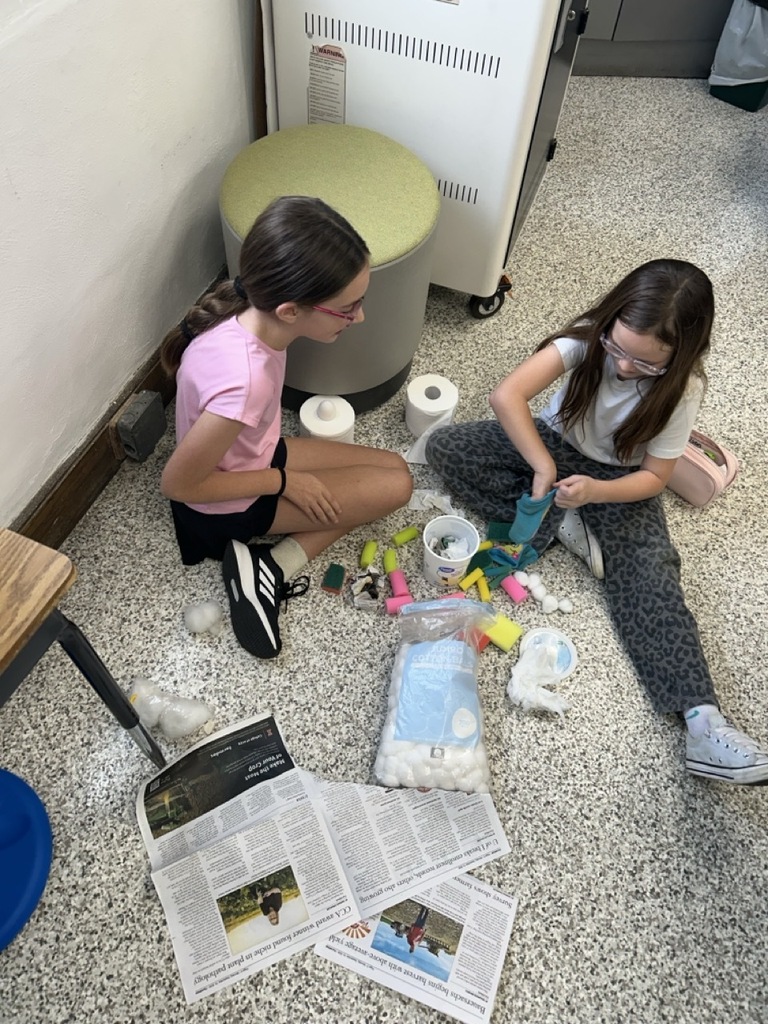Students creating egg holders. 