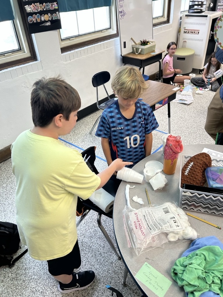 Students creating egg holders. 