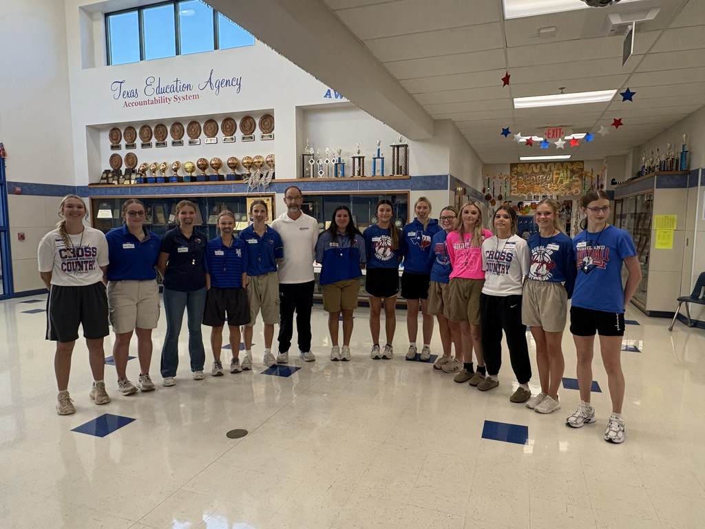 Girls dressed as Coach Baucom