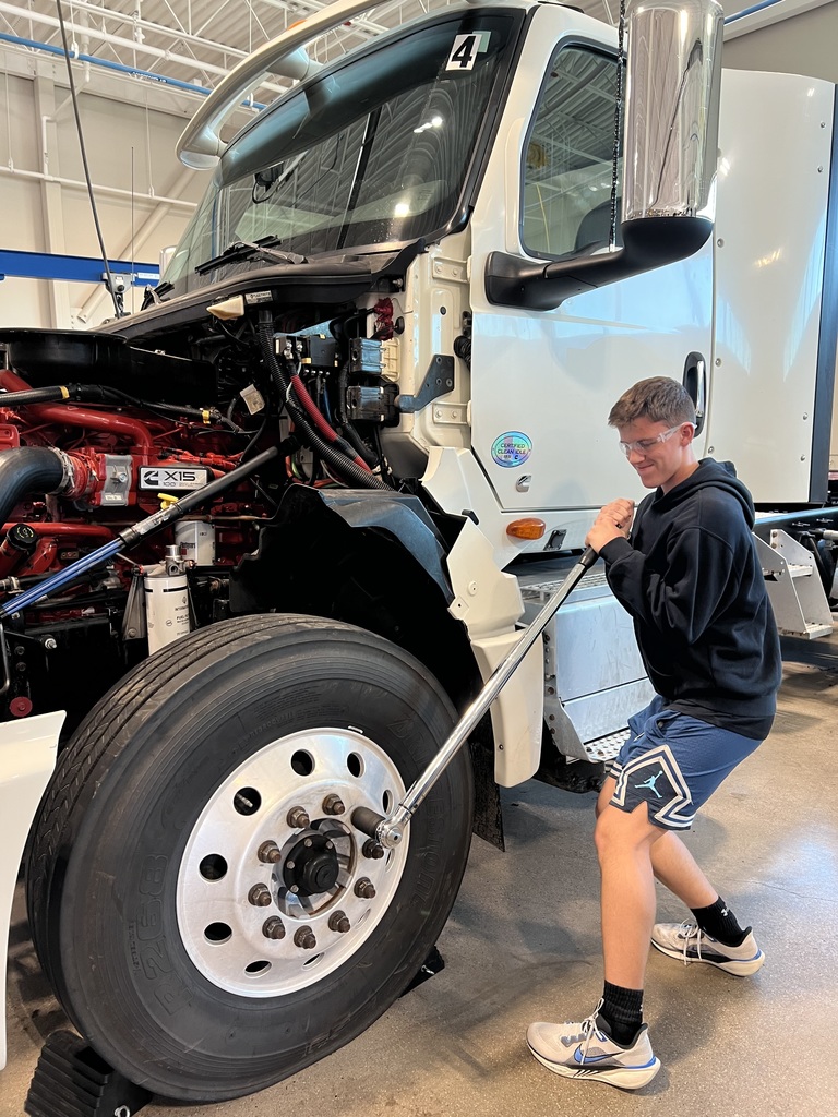 Student changing a tire
