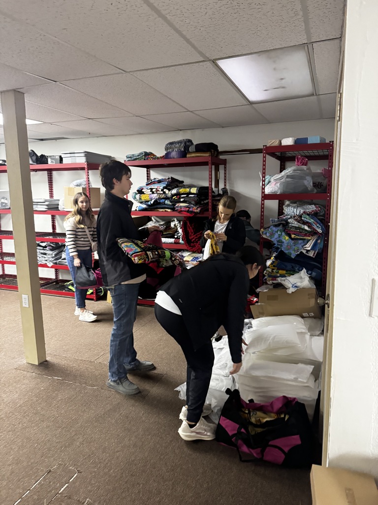 Seniors packing bags at Nurture Nolan