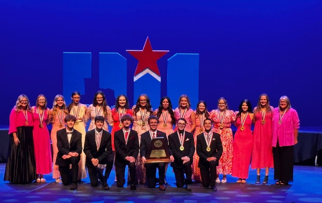 Cast and crew with medals