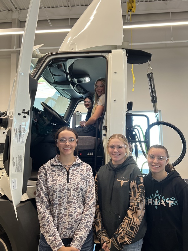 Students exploring trucking program