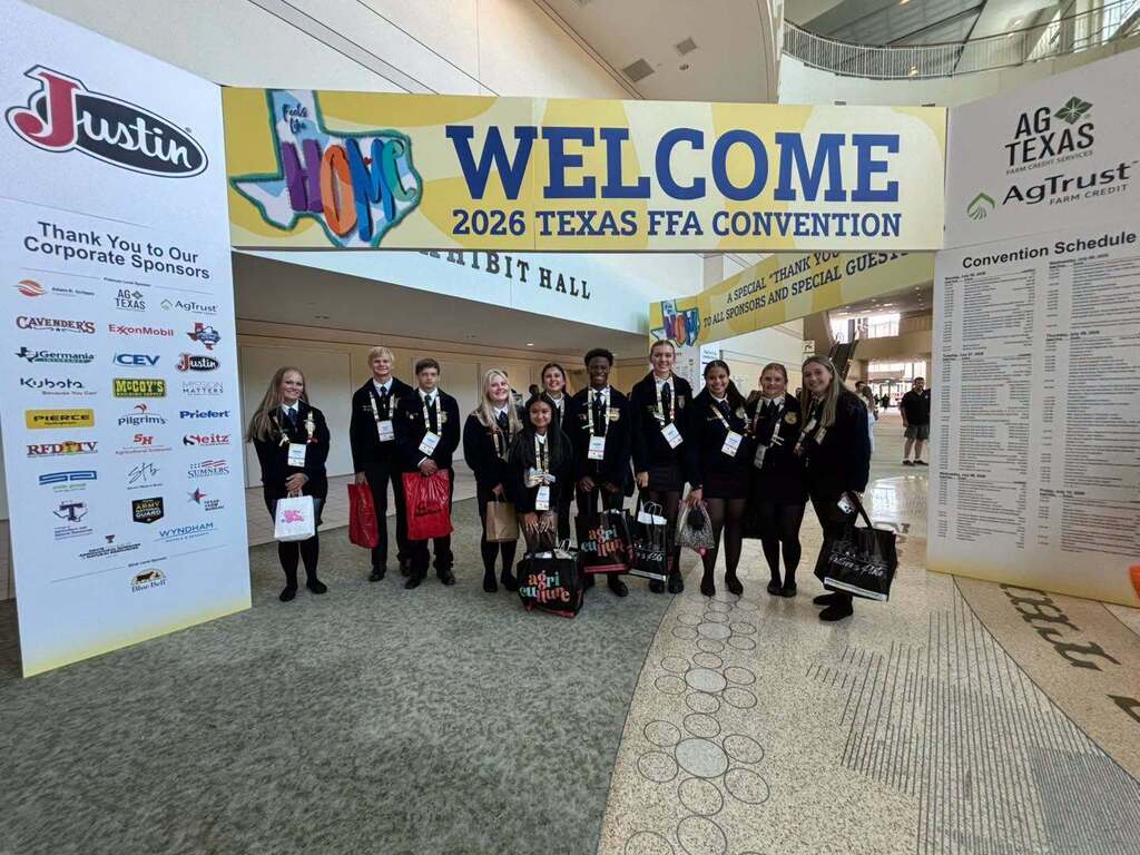 Hillsboro FFA Students Pose at Welcome to Texas FFA Convention Sign