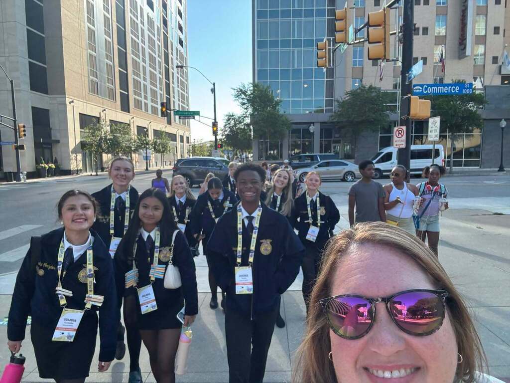 Hillsboro FFA Students and Advisor take a selfie walking to the convention