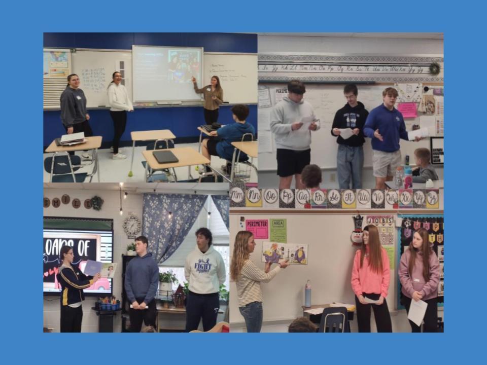 HiSTEP Educators reading a book in class.