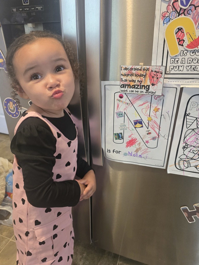 Picture of 3-year-old Nola standing next to a fridge. October 6th we urge everyone to wear green in support of National Liver Awareness Month.