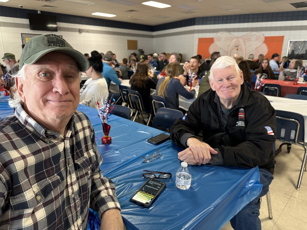 Two Hillsboro Army Veterans pose for a picture after eating breakfast at our Veterans Day Breakfast and Assembly at the junior high.
