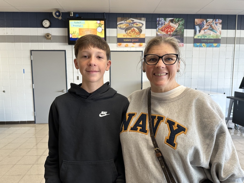 A student and his mother (a navy veteran) pose for a picture at our junior high breakfast and assembly at the junior high.