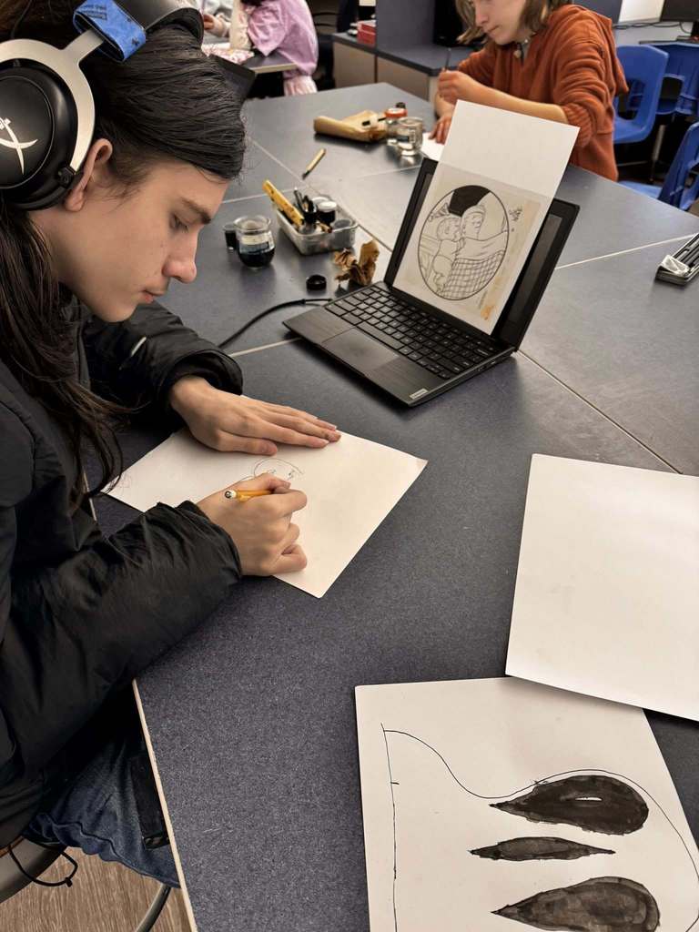 Student practices techniques for illustration and cartooning