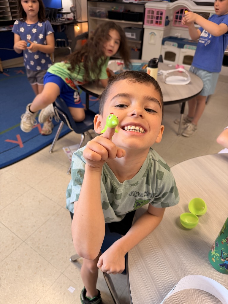 Student holding a toy baby chick 