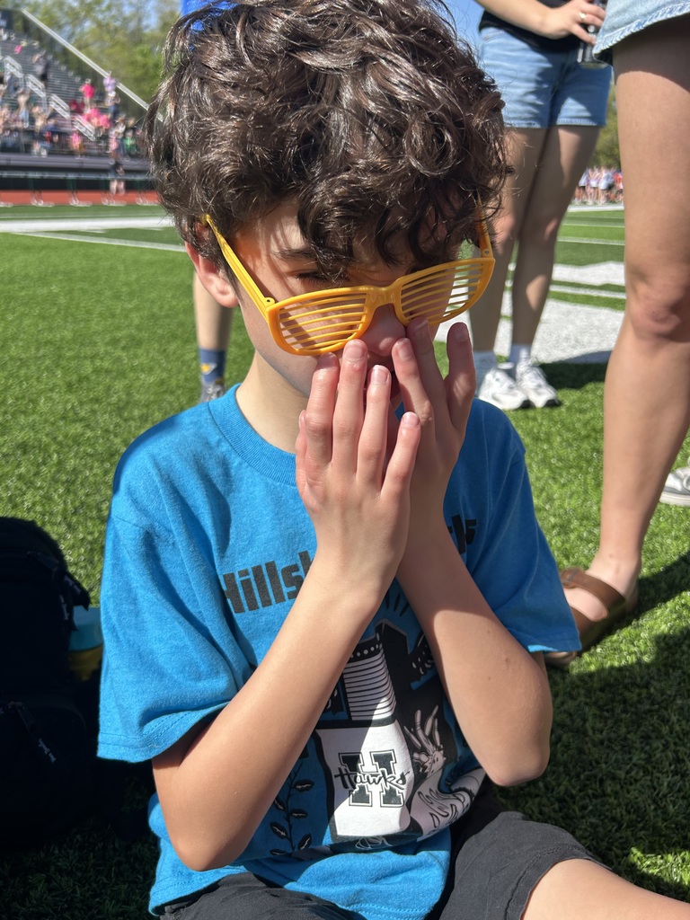 a student hides behind sunglasses with a wry smile during the special olympics in de soto. 