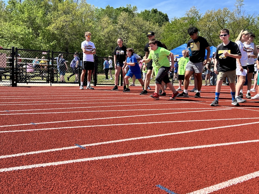 several students start to run on a track during a race at the special olympics in de soto. 