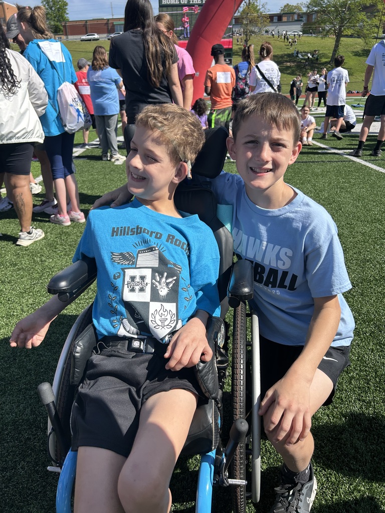 Two students smiling at the camera during the Special Olympics in De Soto. 