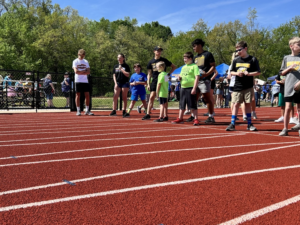 several students get ready to race on a track during the special olympics in de soto
