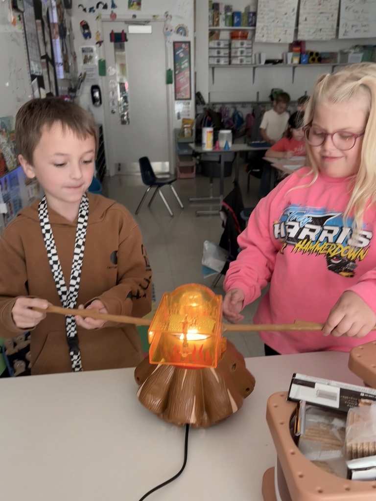 two students making s'mores