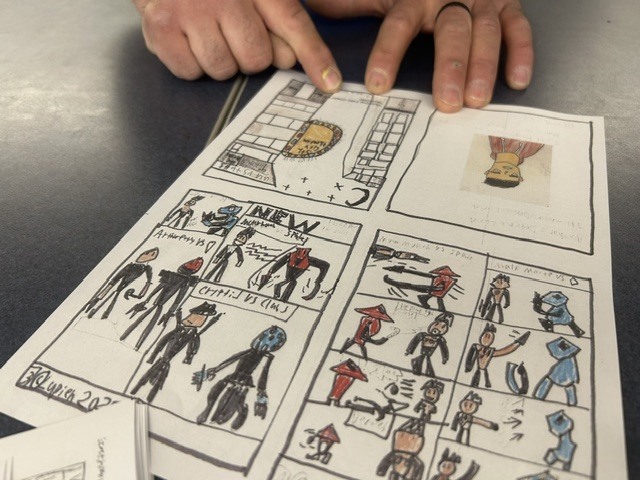 It takes a steady hand to fold a handmade comic book.