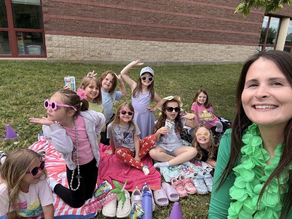 Image of Ms. Jarvis and her students enjoying a nice spring day. 