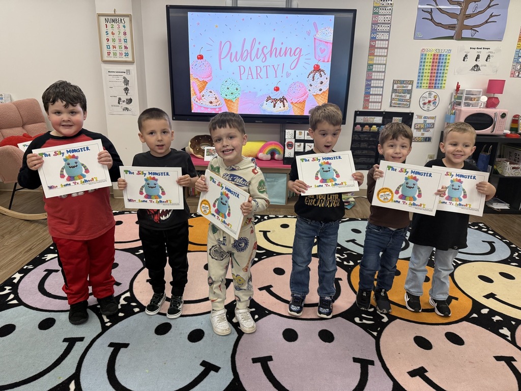Picture of published authors smiling at the camera from the Early Childhood Center.