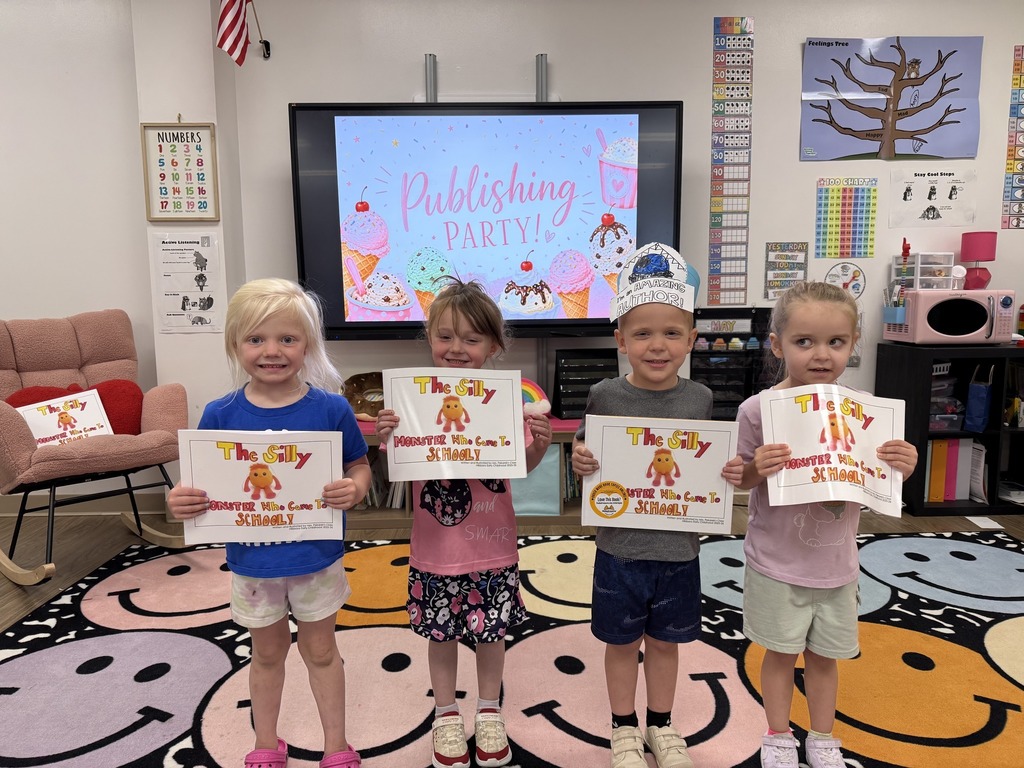 Picture of published authors smiling at the camera from the Early Childhood Center.