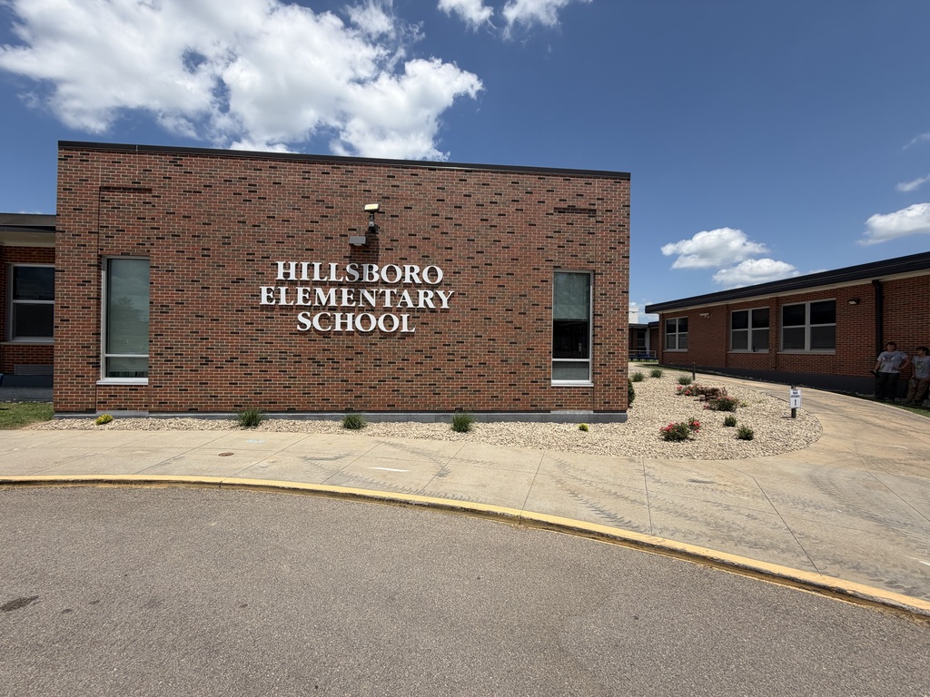 several new plants, "planted" outside of the front entrance to Hillsboro Elementary School