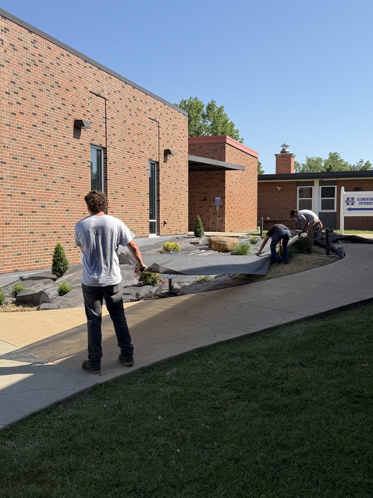 several new plants, "planted" outside of the front entrance to Hillsboro Elementary School