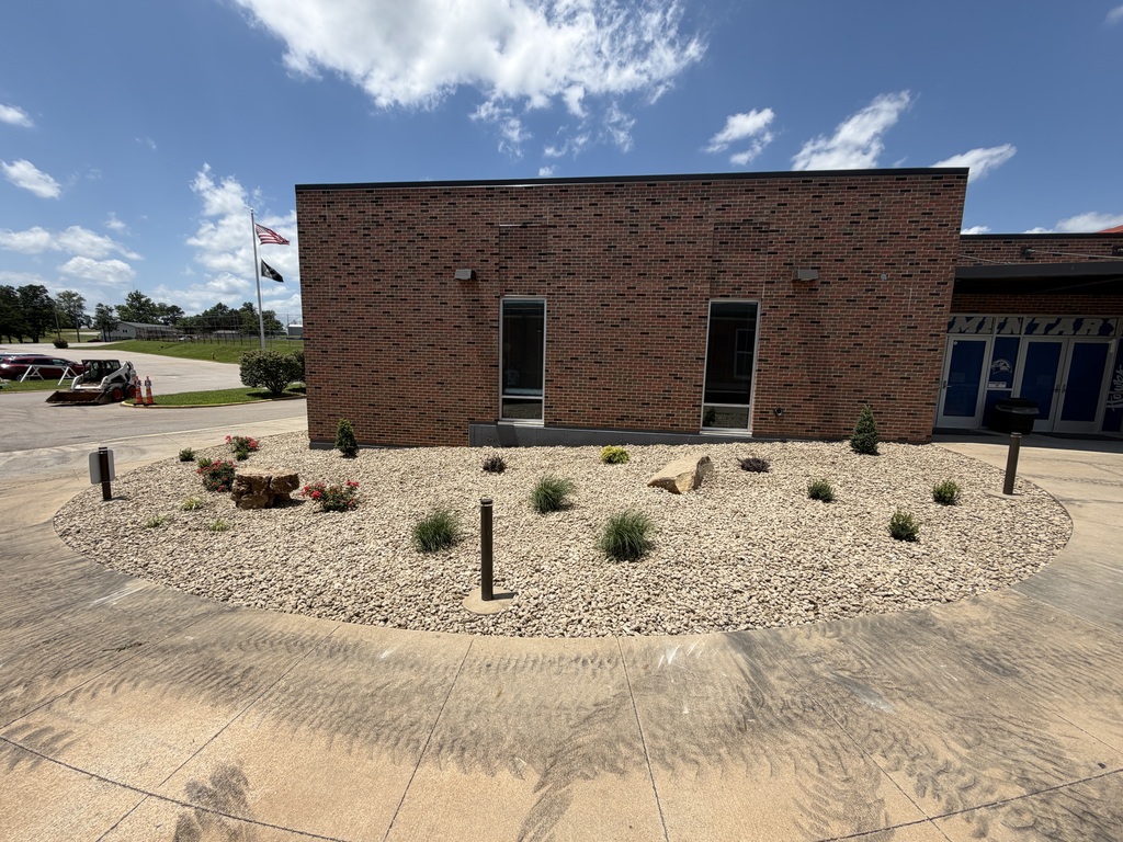 several new plants, "planted" outside of the front entrance to Hillsboro Elementary School