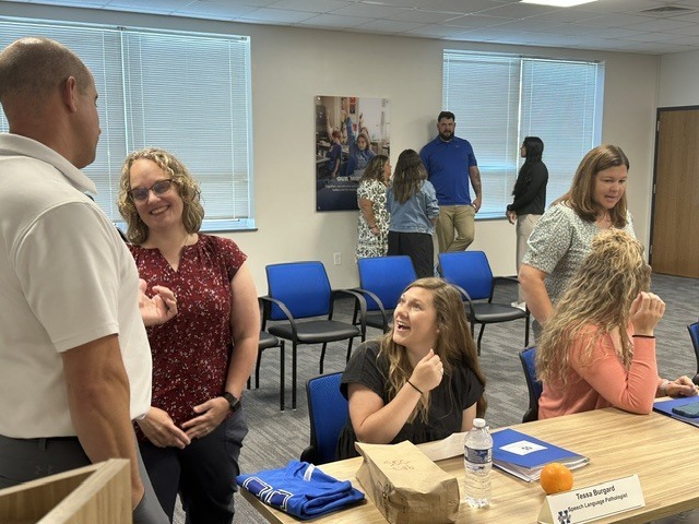 People mingling as they get to know each other during orientation.