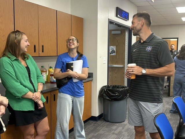 People mingling as they get to know each other during orientation.