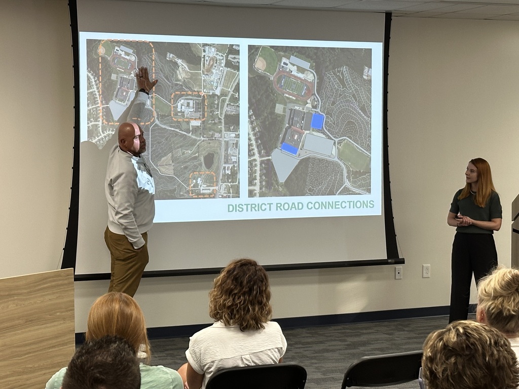 Dr. Jon Isaacson explains during the meeting about the possibility of expanding parking at the high school to help people attending sporting events.