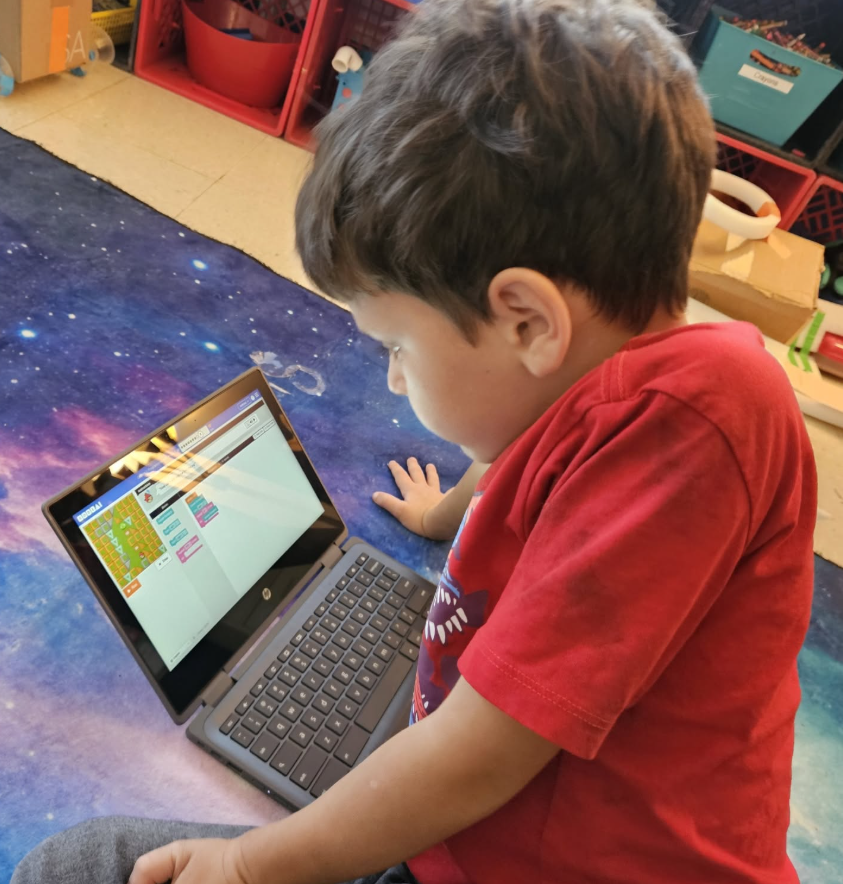 student working at a laptop