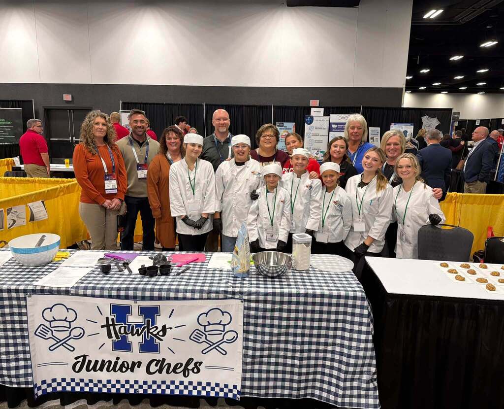 students smile at camera during junior chefs competition