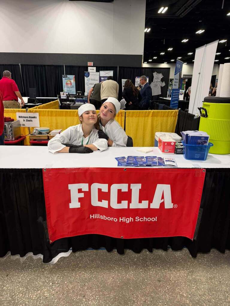 students smile at camera during junior chefs competition