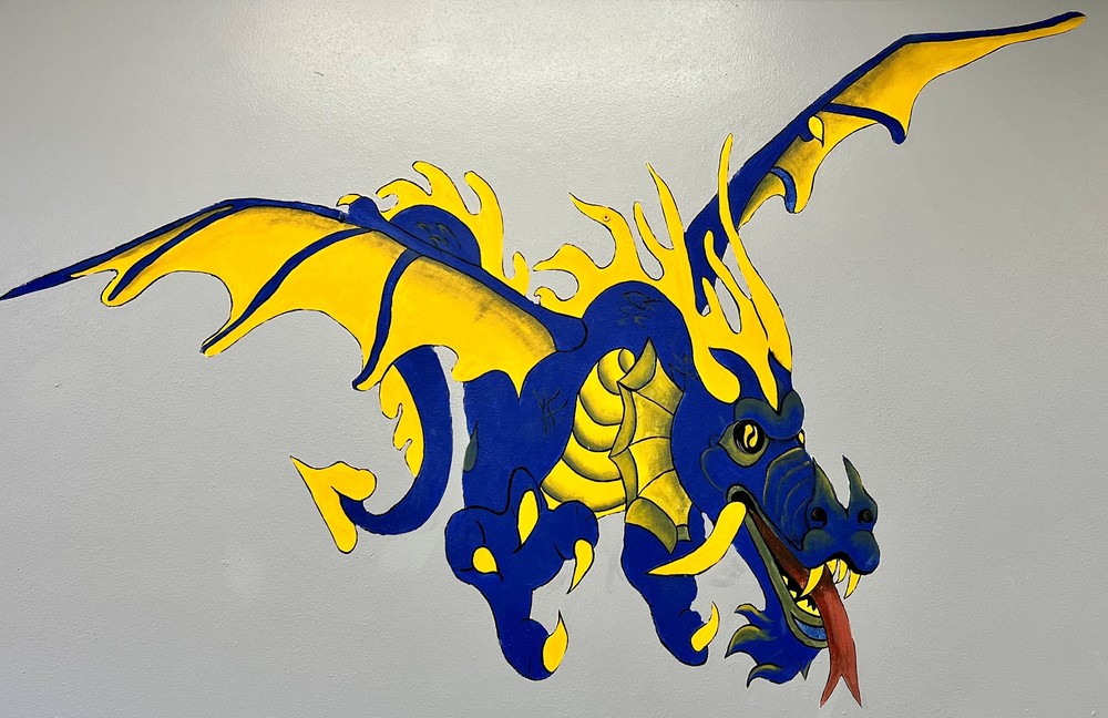 Yellow and Blue Dragon in flight