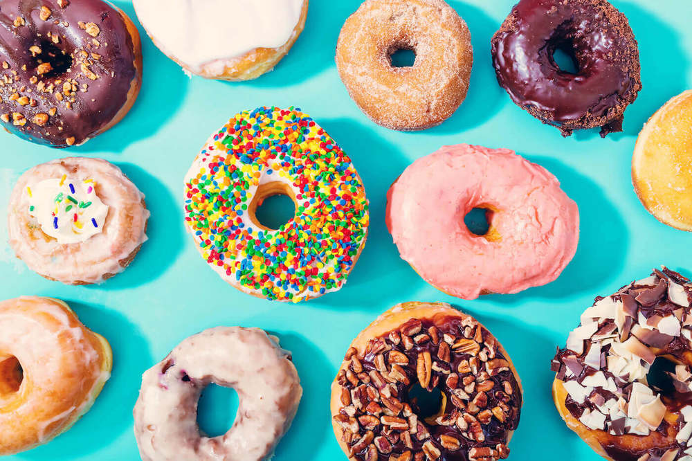 Variety of donuts on a blue background