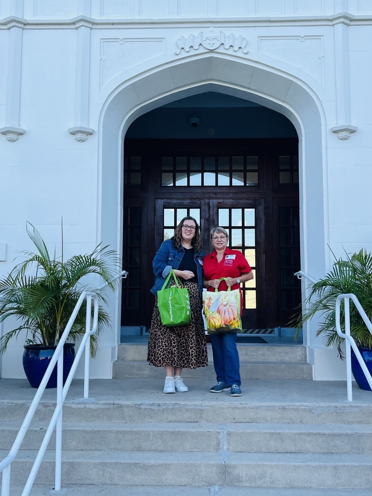 Principal and Member of American Legion outside of school with donations