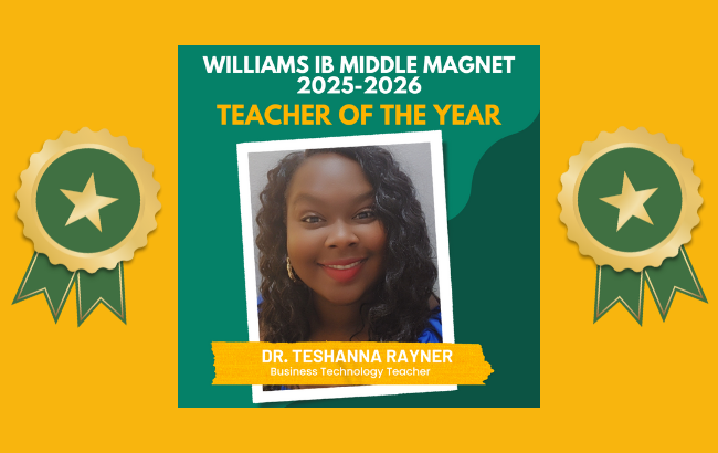 person with long, wavy black hair and red lipstick smiling at the camera