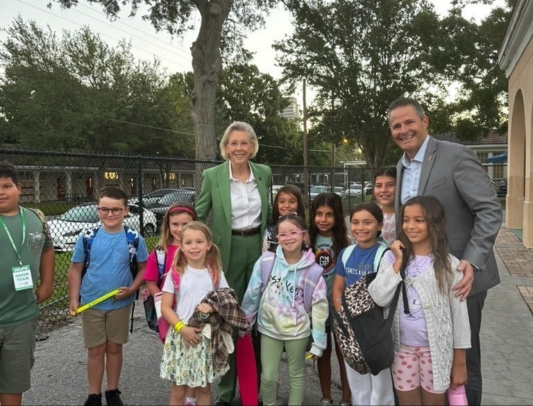 Mayor and Superintendent with students