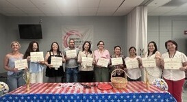 students holding certificate