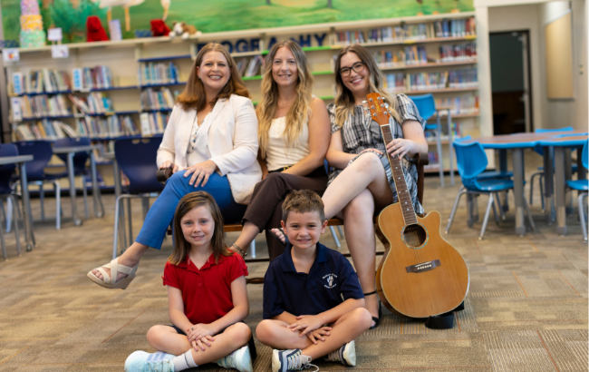 STUDENTS WITH TEACHERS AND GUITAR