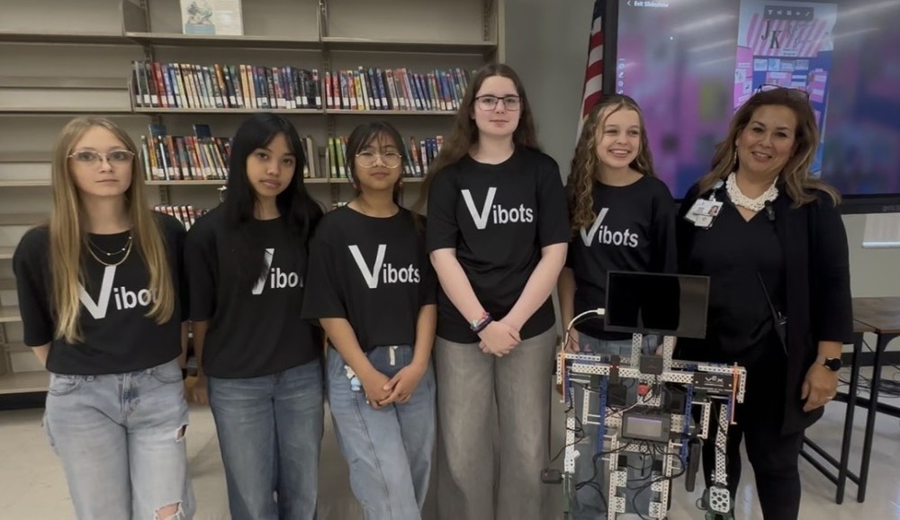 Rodgers all girls robotics team with principal duran
