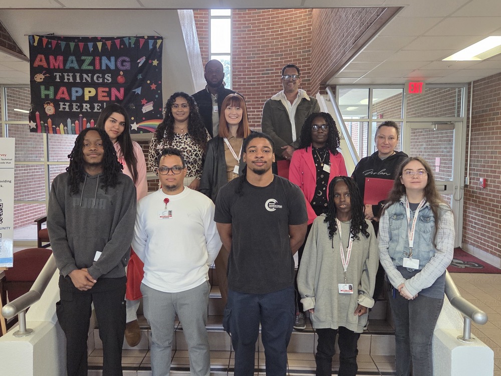 students standing on stairs
