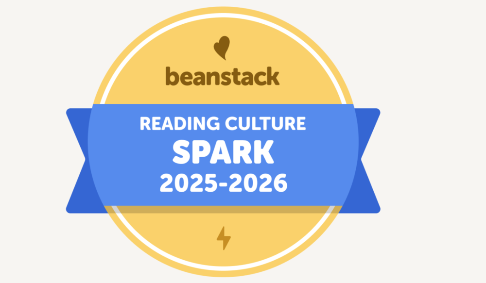 yellow circular badge with a blue banner in the middle