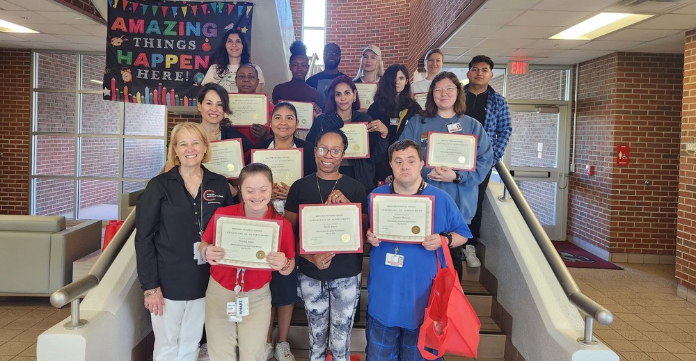 students holding certificate